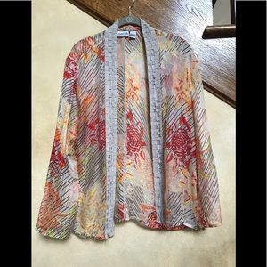 7 Chico’s Tops size 2 (Large)